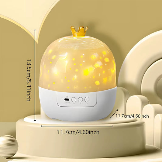 White and gold crown-shaped star projector night lamp glowing with stars